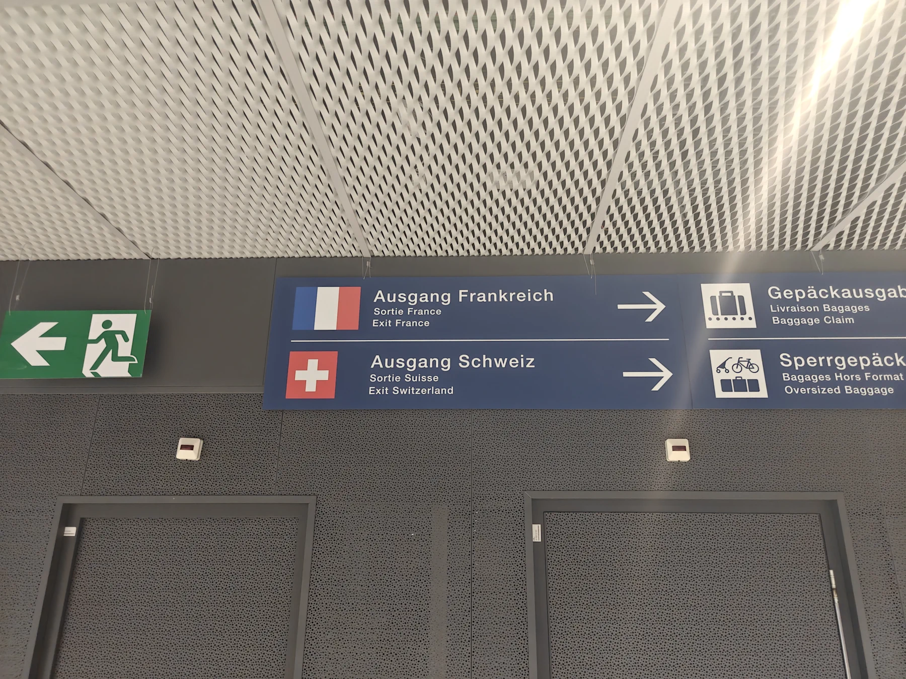 France Exit and Swiss Exit signs at Basel Airport